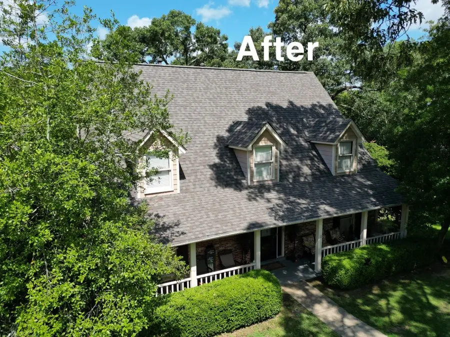 Two-story house with a new shingle roof